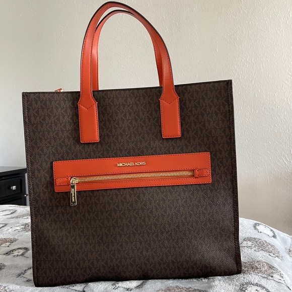 Orange and brown large MK Tote. Bag has a long adjustable strap. - Picture 2 of 3